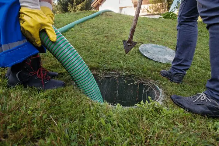 Accessing septic tank for inspection and cleaning service